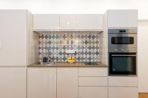 A kitchen or kitchenette at Royal Ferenciek Apartment