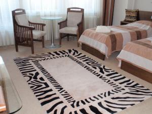 Posteľ alebo postele v izbe v ubytovaní Afrika Hotel Frýdek-Místek