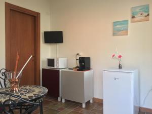 Kuchyň nebo kuchyňský kout v ubytování Cala San Francesco B&B