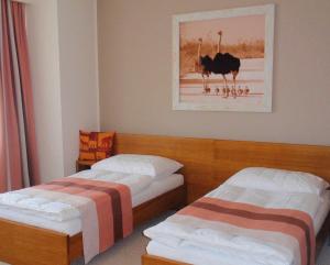 Posteľ alebo postele v izbe v ubytovaní Afrika Hotel Frýdek-Místek