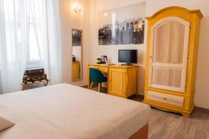 TV a/nebo společenská místnost v ubytování Demithos Rooms