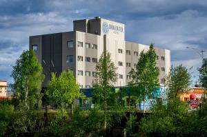 a building with a sign on the top of it at Bridgewater Hotel, Trademark Collection by Wyndham in Fairbanks