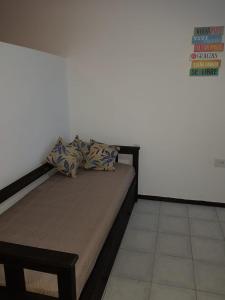 a bed with two pillows on it in a room at Departamento Centro in La Rioja