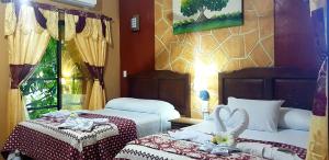 Postel nebo postele na pokoji v ubytování Hotel Mayahau Coba