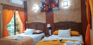 Postel nebo postele na pokoji v ubytování Hotel Mayahau Coba
