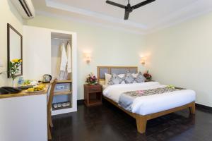 Postel nebo postele na pokoji v ubytování Grand Bayon Siem Reap Hotel