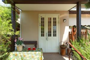 a front door of a house with a table at AbbeyRoad Inn Seika in Seika