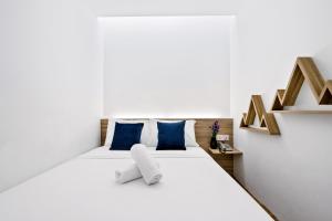 Postel nebo postele na pokoji v ubytování Rica Hotel Usj