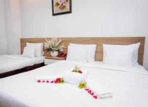 Postel nebo postele na pokoji v ubytování H79 HOTEL
