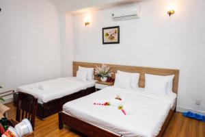 Postel nebo postele na pokoji v ubytování H79 HOTEL