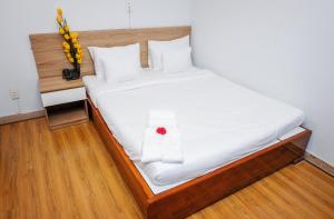 Postel nebo postele na pokoji v ubytování H79 HOTEL