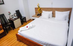 Postel nebo postele na pokoji v ubytování H79 HOTEL