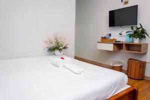Postel nebo postele na pokoji v ubytování H79 HOTEL