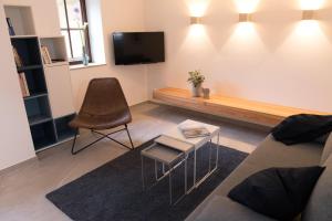 TV a/nebo společenská místnost v ubytování Wenkheimer Hof Ferienwohnung