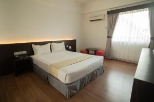 Giường trong phòng chung tại Hotel Seri Malaysia Sungai Petani
