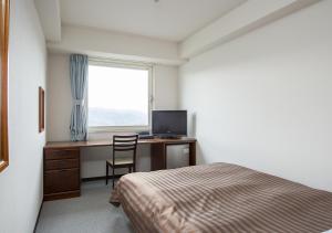 TV a/nebo společenská místnost v ubytování Komoro Grand Castle Hotel