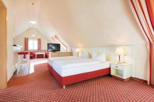Ένα ή περισσότερα κρεβάτια σε δωμάτιο στο Hotel Landgasthof Hofmeier +22 φωτογραφίες