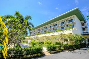 a building with plants on the side of it at Blue Beach Grand Resort And Spa in Rawai Beach