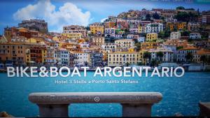 a poster for bix boat argentina with a city at Bike&Boat Argentario Hotel in Porto Santo Stefano