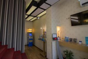 a lobby with a gas station with a ticket machine at Cosmopolit in Athens