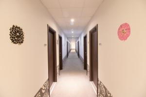 a corridor of a hospital hallway with doors at Cosmopolit in Athens
