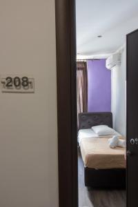 a bedroom with two beds and a sign that says at Cosmopolit in Athens