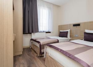 Postel nebo postele na pokoji v ubytování Princess Residence