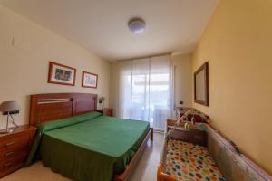 Postel nebo postele na pokoji v ubytování Golden Beach Apartamentos + 37 fotografií