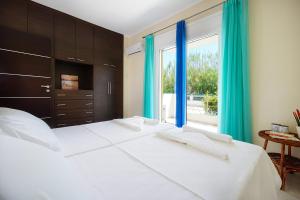 Postel nebo postele na pokoji v ubytování Geas House Thalassa