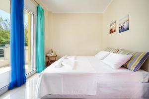Postel nebo postele na pokoji v ubytování Geas House Thalassa