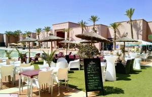 A restaurant or other place to eat at 2 bed apartment on Condado De Alhama with roof solarium N5