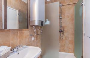 a bathroom with a sink and a shower at H&H seaview in Luz +21 photos