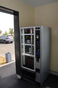 a refrigerator that is in the middle of a parking lot at Fasthotel Le Mans in Saint-Saturnin