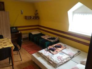 Postel nebo postele na pokoji v ubytování Apartmány Ingrid