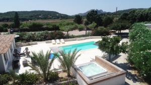 an image of a swimming pool in a yard at Hotel Fazio in Bonifacio