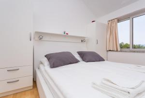 Katil atau katil-katil dalam bilik di Molnar Resort Apartment Ljiljana