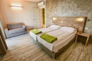 Posteľ alebo postele v izbe v ubytovaní Verdeulivo Relax Home - Ruculì Hospitality