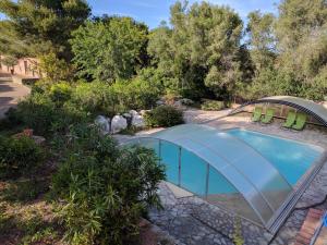 an overhead view of a swimming pool with chairs around it at Finca Sa Tafona in Son Servera