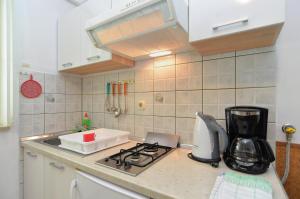 Kuchyň nebo kuchyňský kout v ubytování Pool Apartments 624