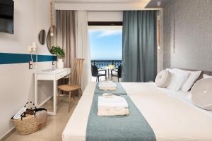 Кровать или кровати в номере Hotel Villa Natassa