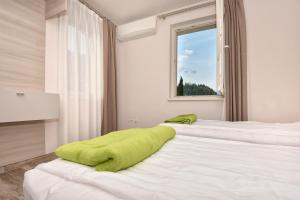 Posteľ alebo postele v izbe v ubytovaní Verdeulivo Relax Home - Ruculì Hospitality