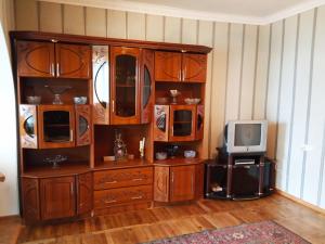 a large wooden entertainment center with a tv on top at Rubina Bed and Breakfast in Tatʼev +41 photos
