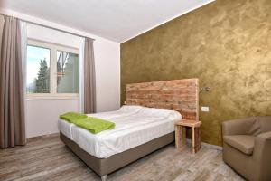 Posteľ alebo postele v izbe v ubytovaní Verdeulivo Relax Home - Ruculì Hospitality