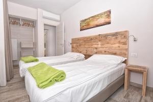 Posteľ alebo postele v izbe v ubytovaní Verdeulivo Relax Home - Ruculì Hospitality