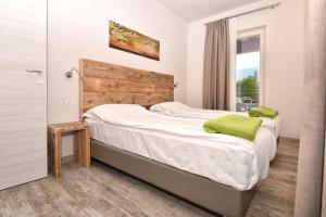 Posteľ alebo postele v izbe v ubytovaní Verdeulivo Relax Home - Ruculì Hospitality