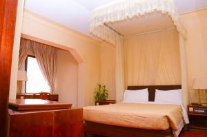 Postel nebo postele na pokoji v ubytování Fang Fang Hotel + 6 fotografií