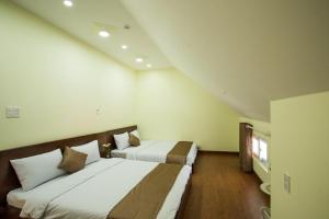 Voodi või voodid majutusasutuse LuTo Hotel toas