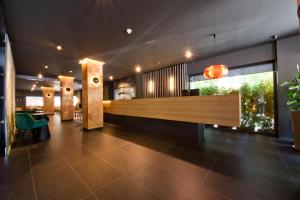 a lobby with a reception desk in a building at Aparthotel Atenea Valles in Granollers