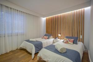 Säng eller sängar i ett rum på Hotel Teresinha