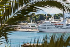two cruise ships are docked in a harbor at Apartments Emi in Split